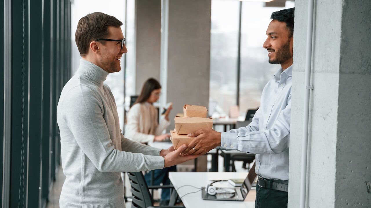 employee paying it forward by giving meal to co worker
